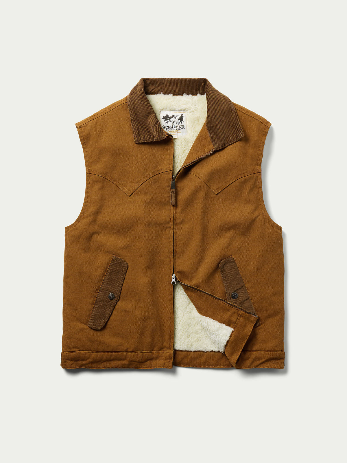 Tan canvas sherpa-lined vest with front zipper and two chest utility pockets