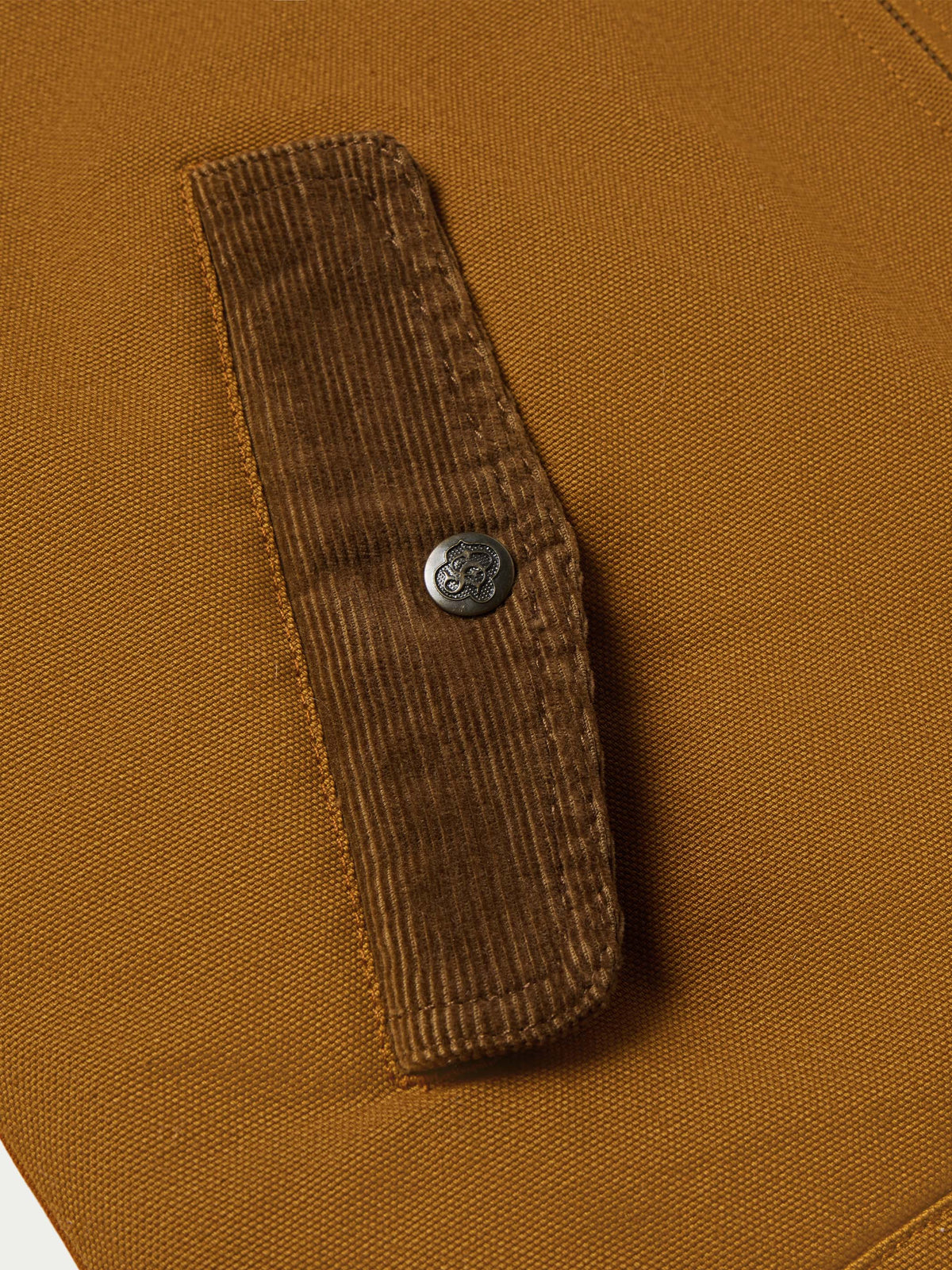 Sandstone canvas vest with sherpa lining and metal button snap