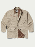 Beige drifter coat with brown collar, button front, and flap chest pockets