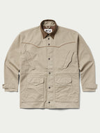 Front view beige drifter coat with brown collar, snap buttons, and chest pockets