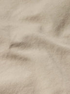 Beige drifter coat fabric texture close-up