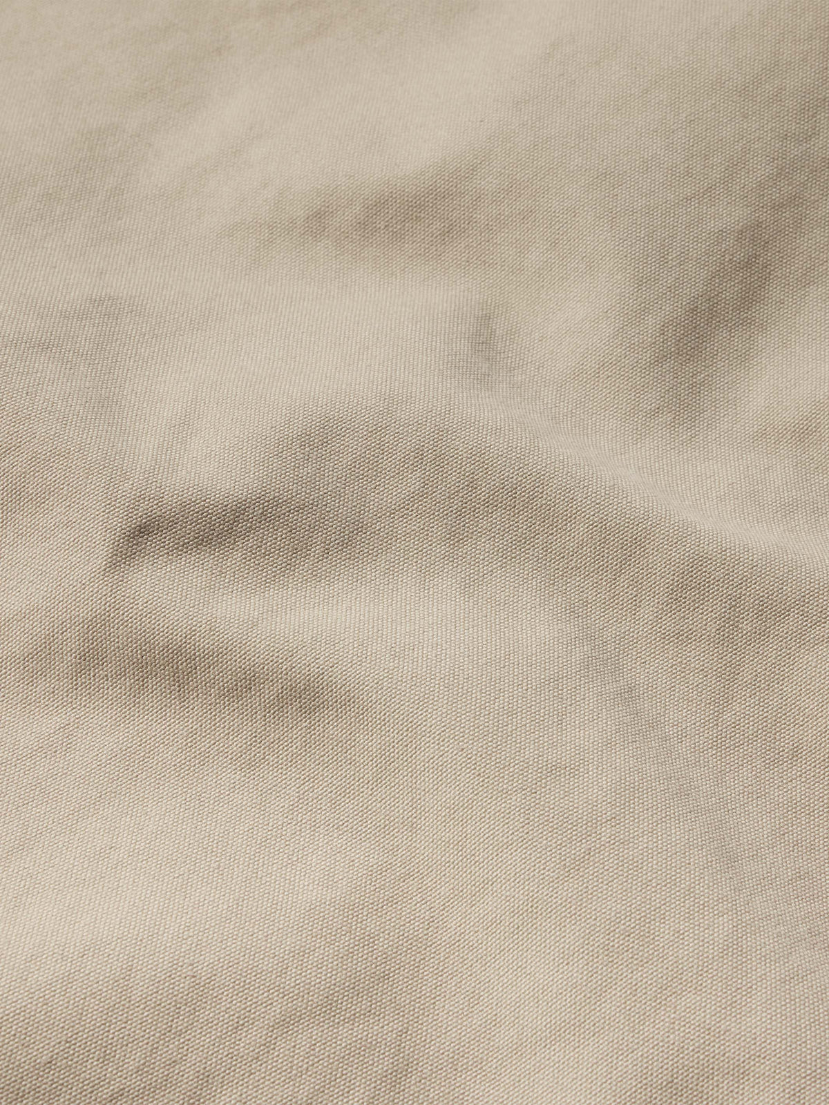 Beige drifter coat fabric texture close-up