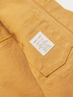 Suntan brush jacket interior pocket with stitched hem and sewn label.