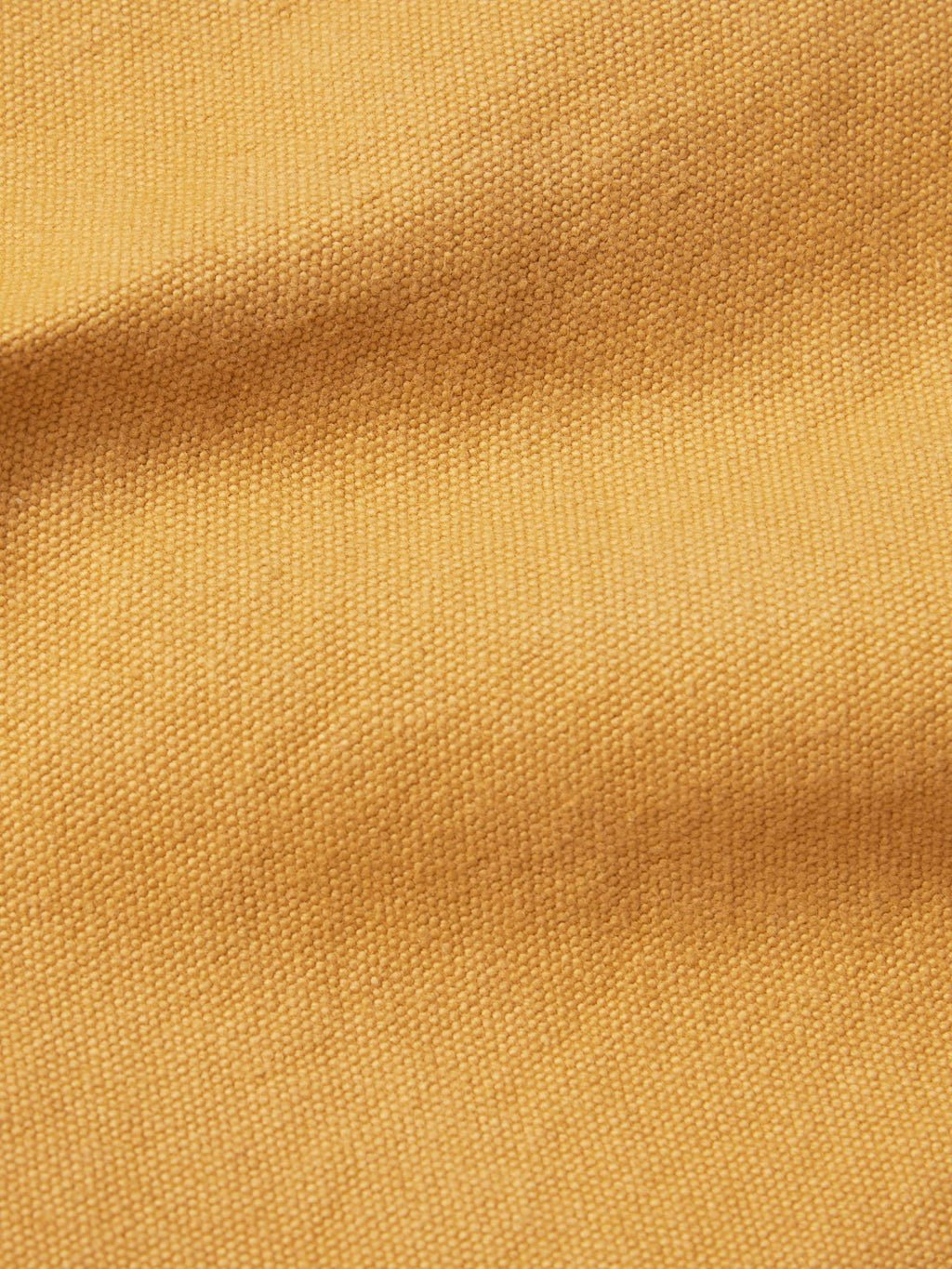 Suntan brush jacket fabric texture close-up.