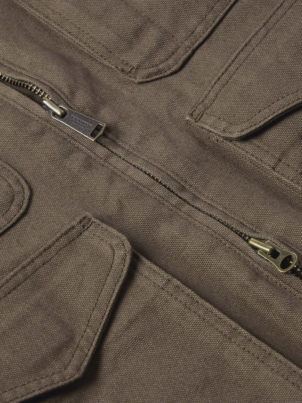 Stone canvas ranch jacket chest area with two zipper pulls