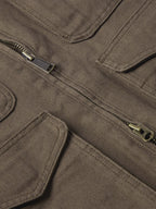 Stone canvas ranch jacket chest area with two zipper pulls