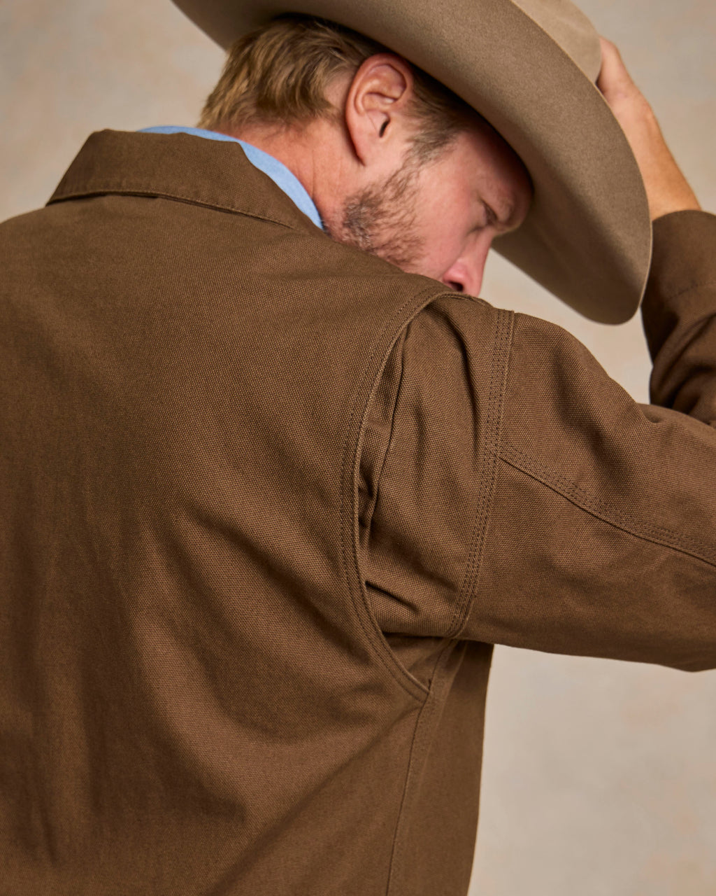 Hickory canvas jacket close-up at back neck and shoulder with collar seam and stitching