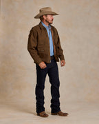 Hickory canvas zip jacket on model, side view with snap chest pockets and hem