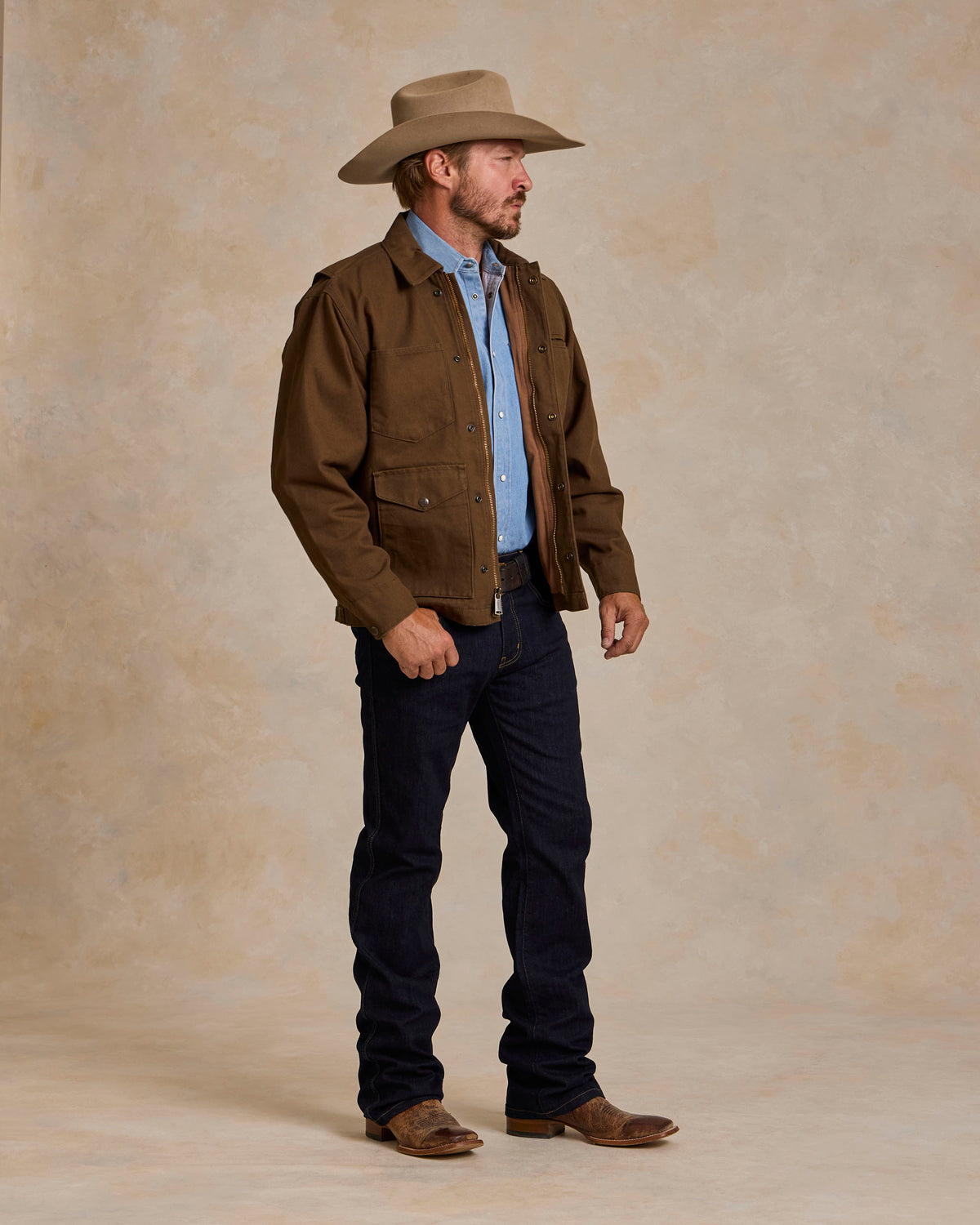 Hickory canvas zip jacket on model, side view with snap chest pockets and hem