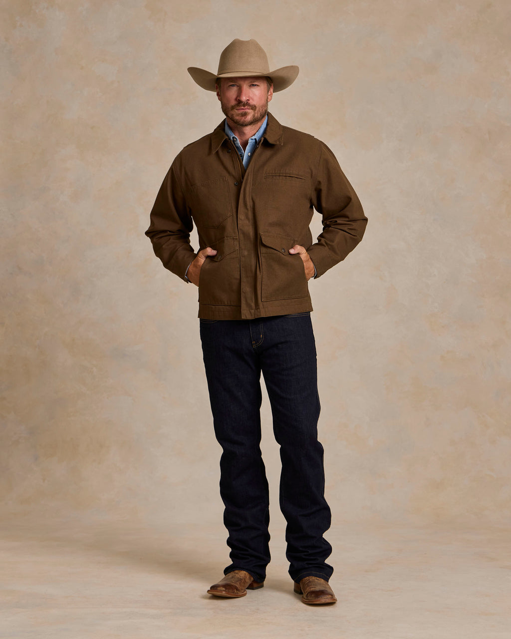 Hickory canvas zip jacket on model, standing front view with collar and chest pockets
