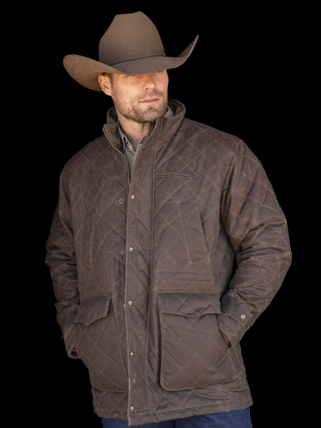 Man wearing RangeWax® quilted jacket in dark brown with stand collar and pockets