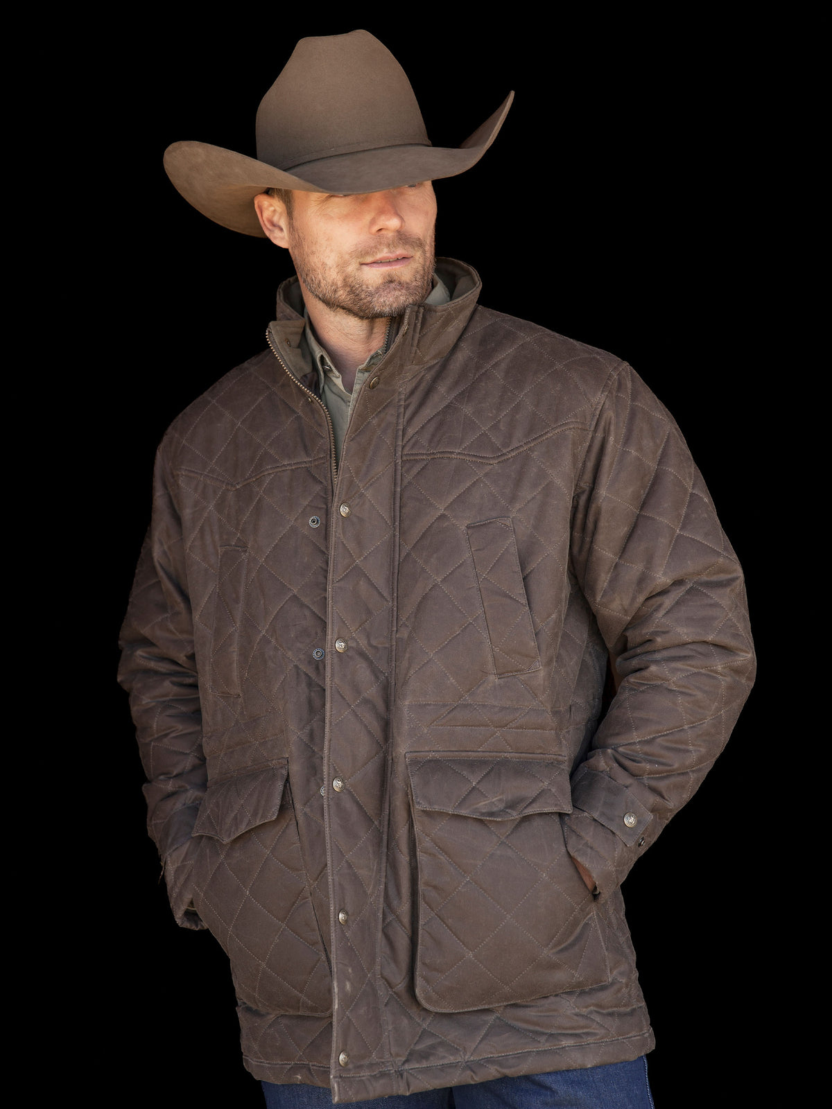 Man wearing RangeWax® quilted jacket in dark brown with stand collar and pockets