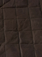 RangeWax® jacket close-up of diamond-quilted dark brown panels