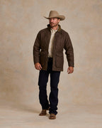 Oak-brown quilted jacket with zip front and stand collar, full body view standing.