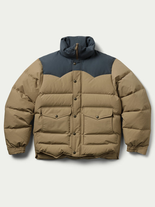 Camel and dark navy down jacket with hood, front placket, and quilted insulation