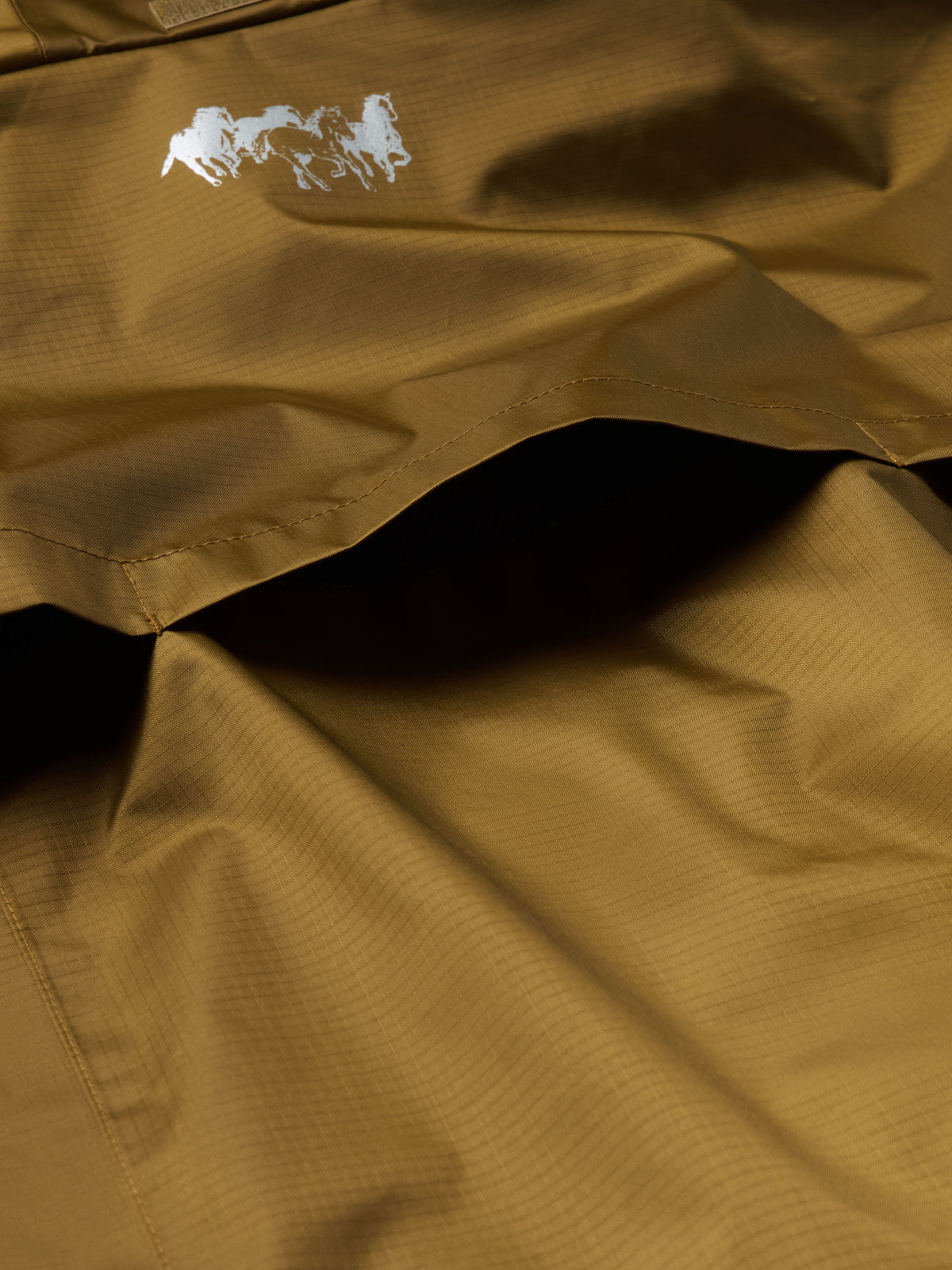 Men's rain jacket front panel with logo detail, brown fabric