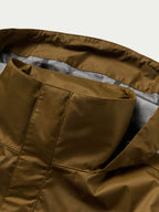 Brown rain jacket lining and inner pocket view from open hood area