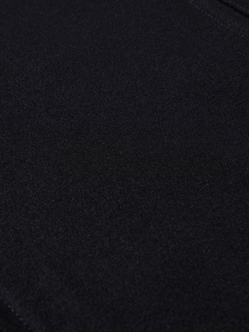 Black wool fabric texture close-up