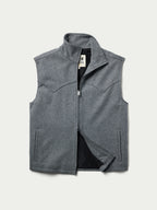 Heather gray wool vest with front zipper and dark inner lining, shown open.