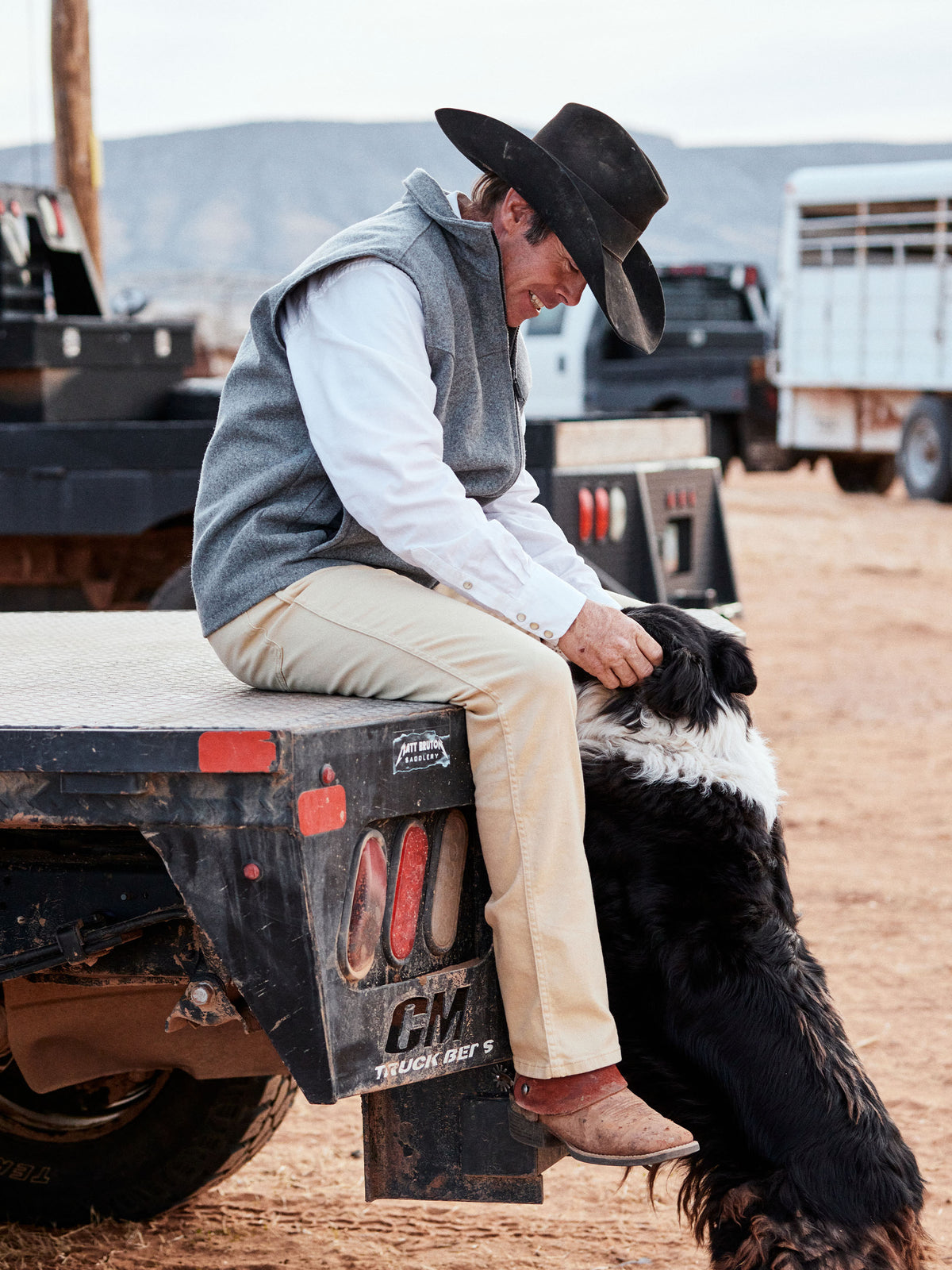 Heather gray wool arena vest with stand collar and front zipper, worn outdoors.