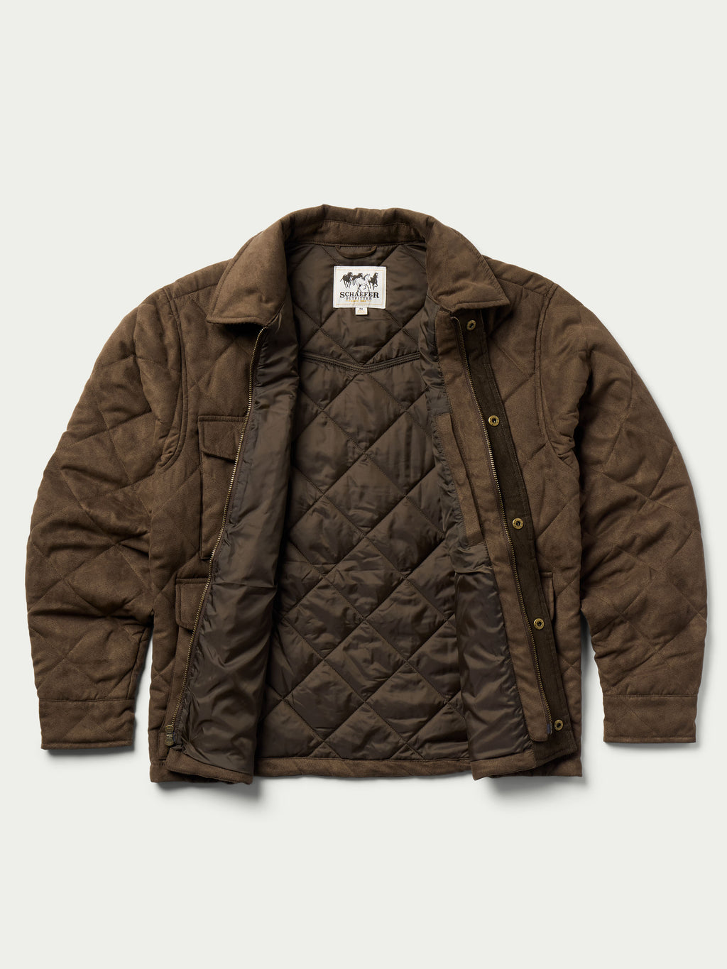 Brown quilted microsuede jacket on model, showing stand collar and snap-front design.