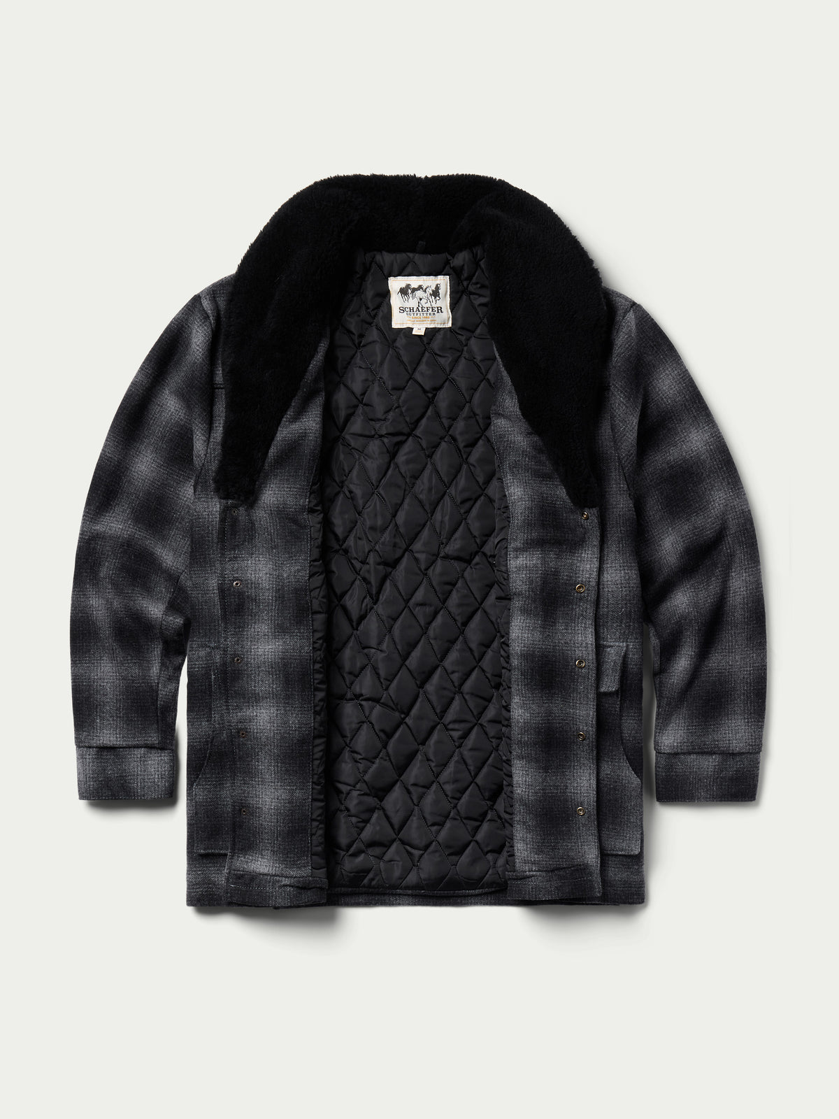 Black wool coat with shearling collar, flat view showing quilted inner lining