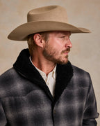 Black wool coat with shearling collar, front button closure and notch lapel