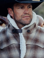 Taupe plaid wool coat with white shearling collar and dark button placket