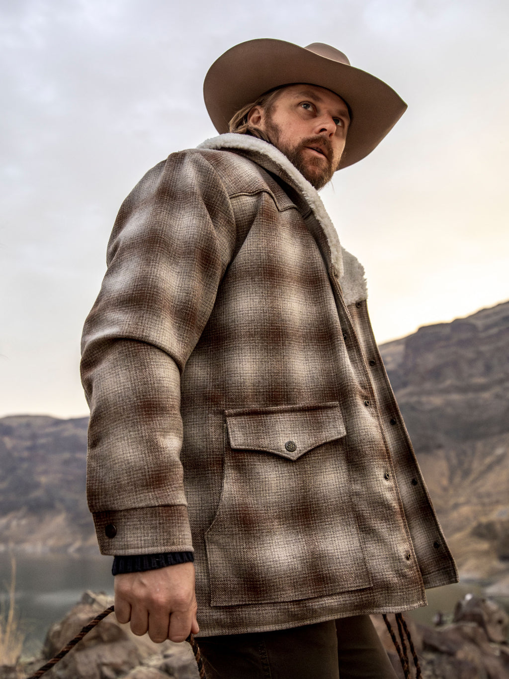 Taupe plaid wool coat with white shearling collar and side buttoned pockets