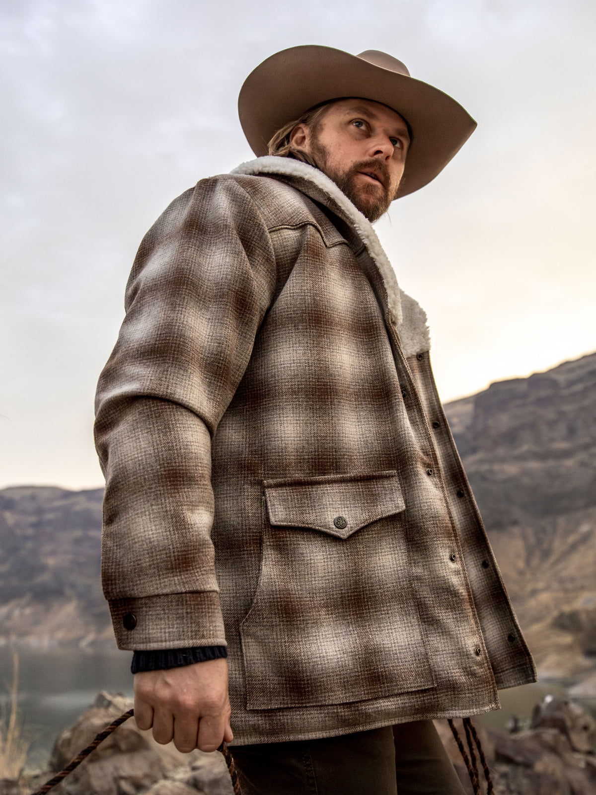 Taupe plaid wool coat with white shearling collar and side buttoned pockets
