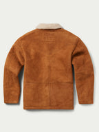 Buckskin shearling coat with cream shearling collar, button front, and side pockets