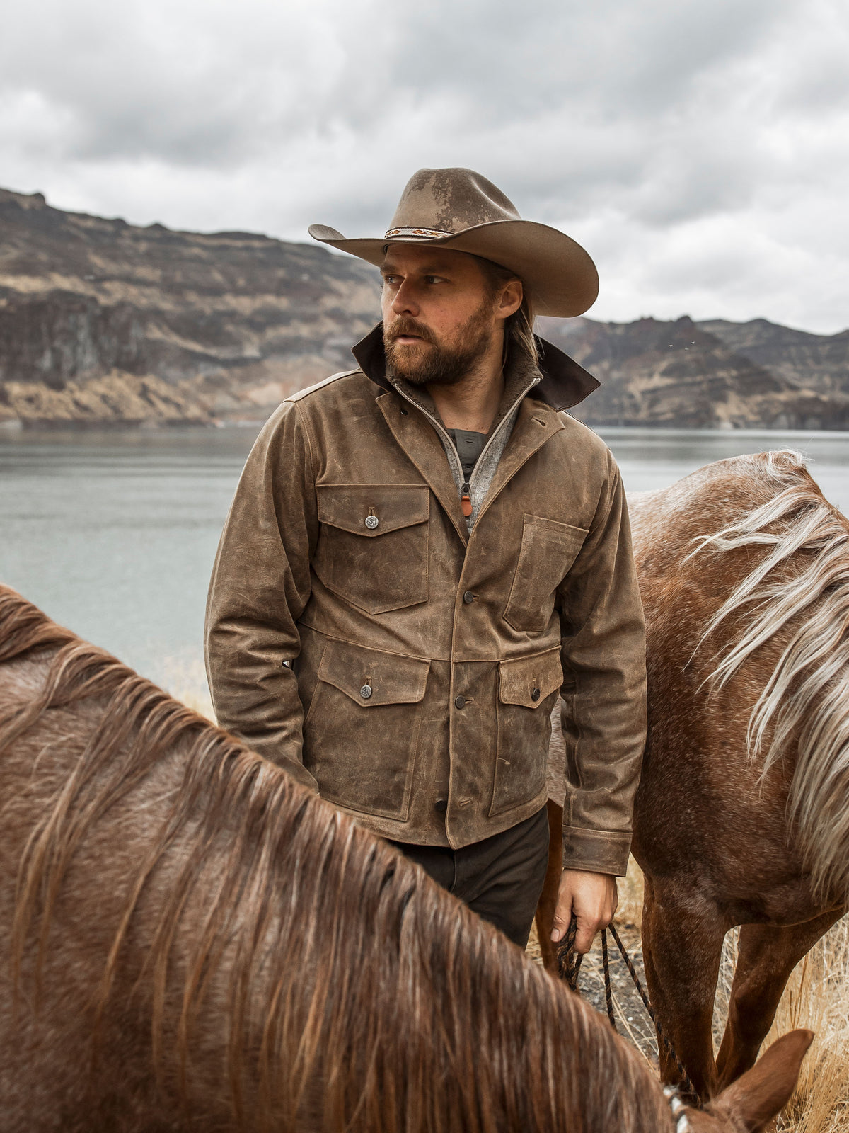 Tan suede brush jacket with zip front, snap pockets, and hooded collar