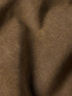 Tan leather fabric texture close-up with subtle grain and finish.