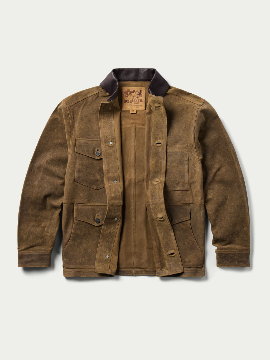 Tan leather brush jacket front view with flap pockets and snap buttons, dark collar.
