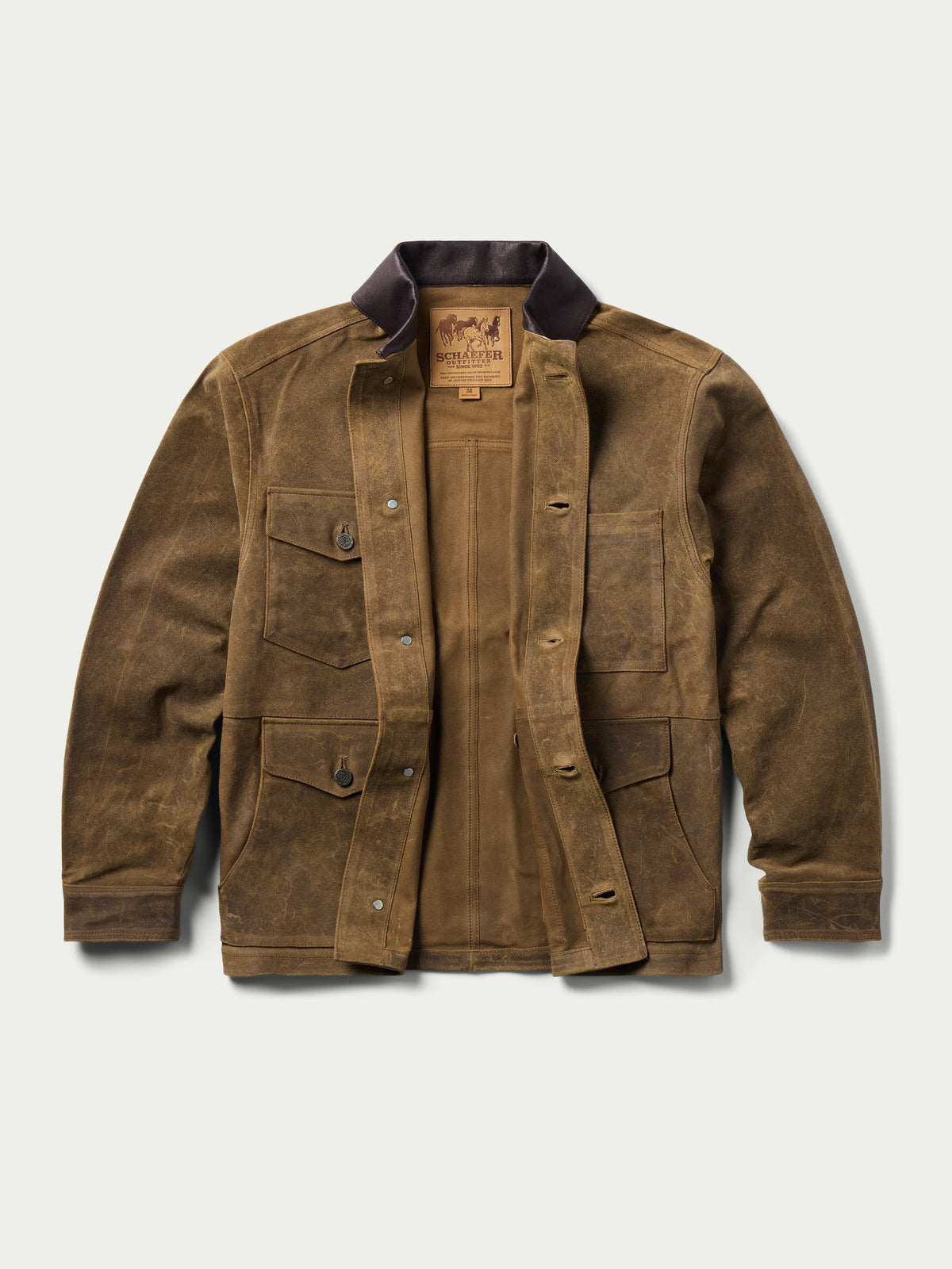 Tan leather brush jacket front view with flap pockets and snap buttons, dark collar.