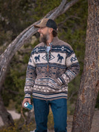 Fair Isle full-zip sweater in brown with navy horse motifs, worn on a person.