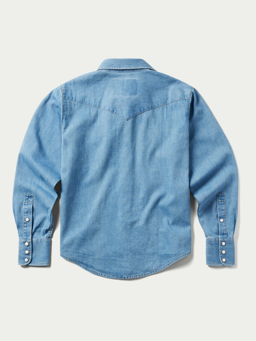 Light wash women's denim pearl snap western shirt, back view, long sleeves