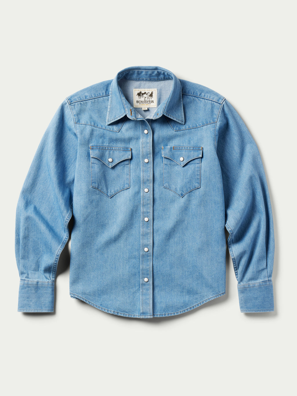Light wash women's denim pearl snap western shirt, front view, long sleeves