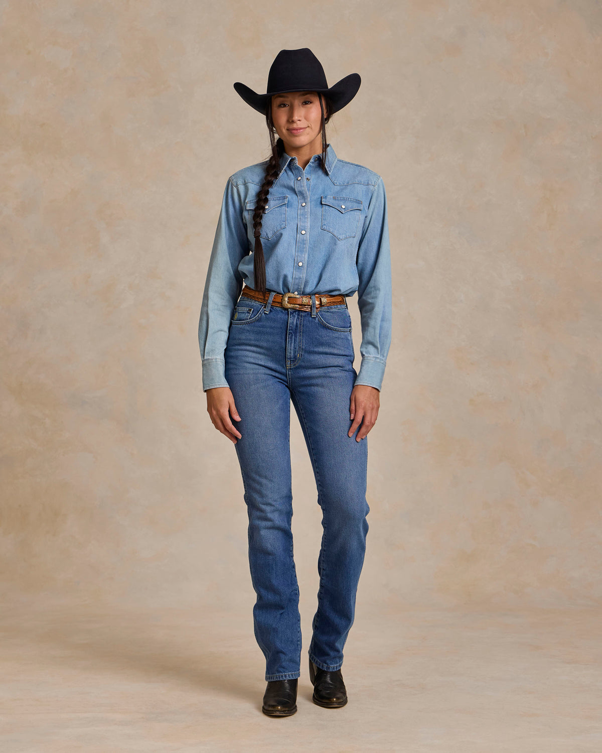 Light wash denim western snap shirt with pearl button closure and chest pockets