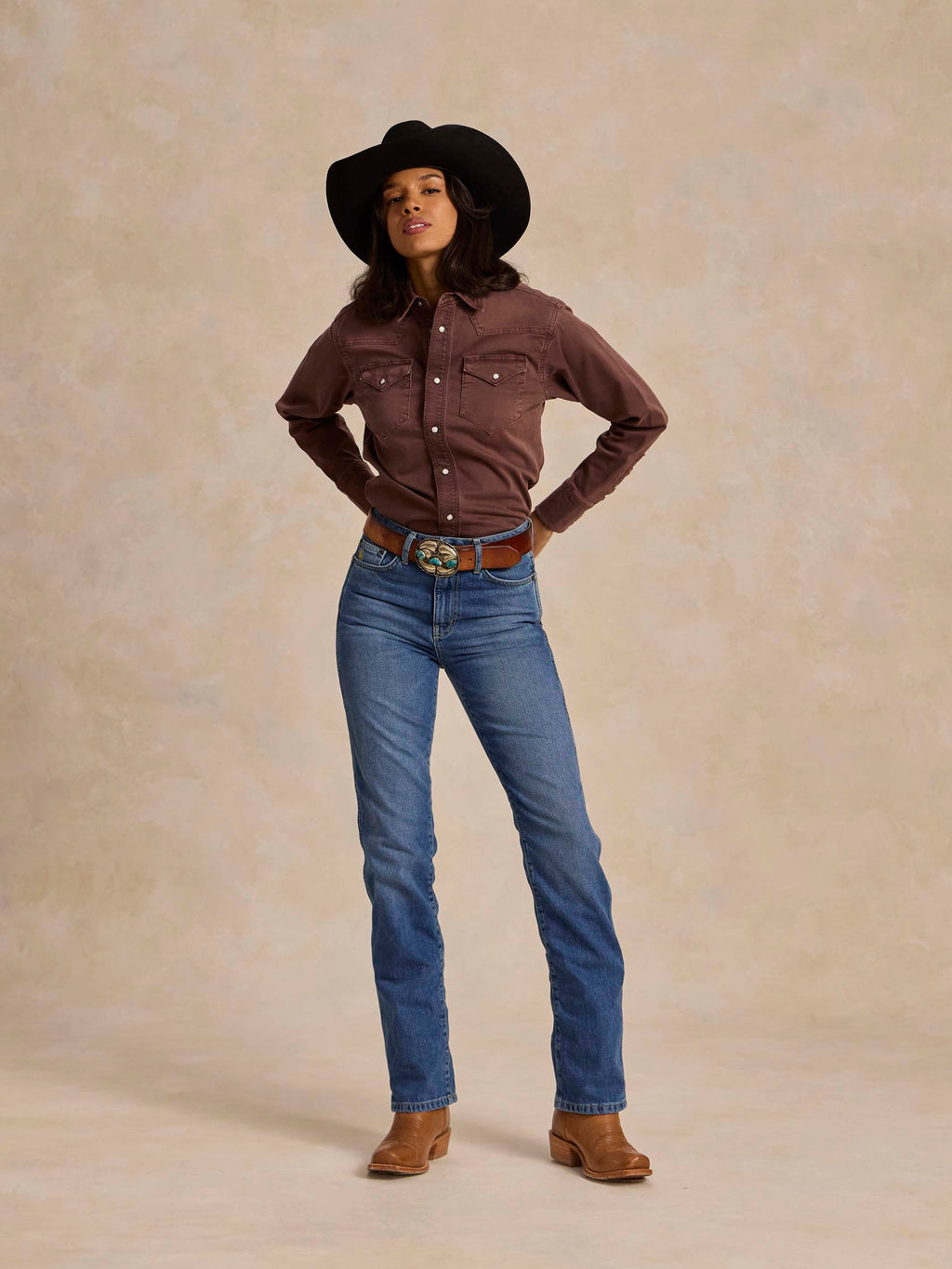 Women's faded maroon western denim snap shirt with snap front and long sleeves