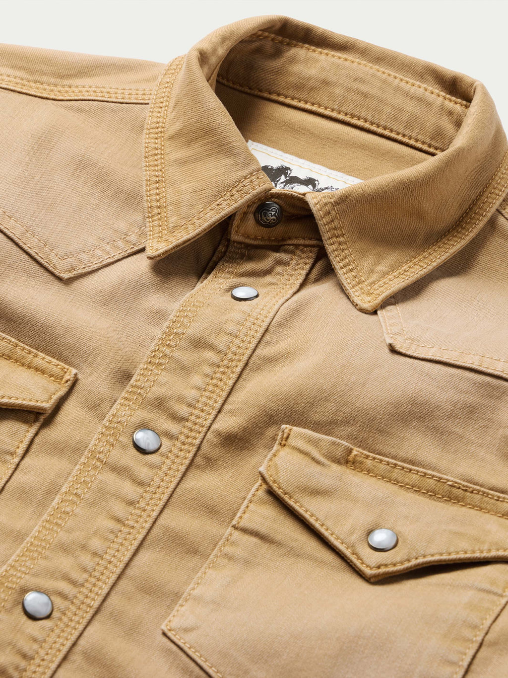 Faded chestnut western snap shirt chest yoke with snap placket and metal button