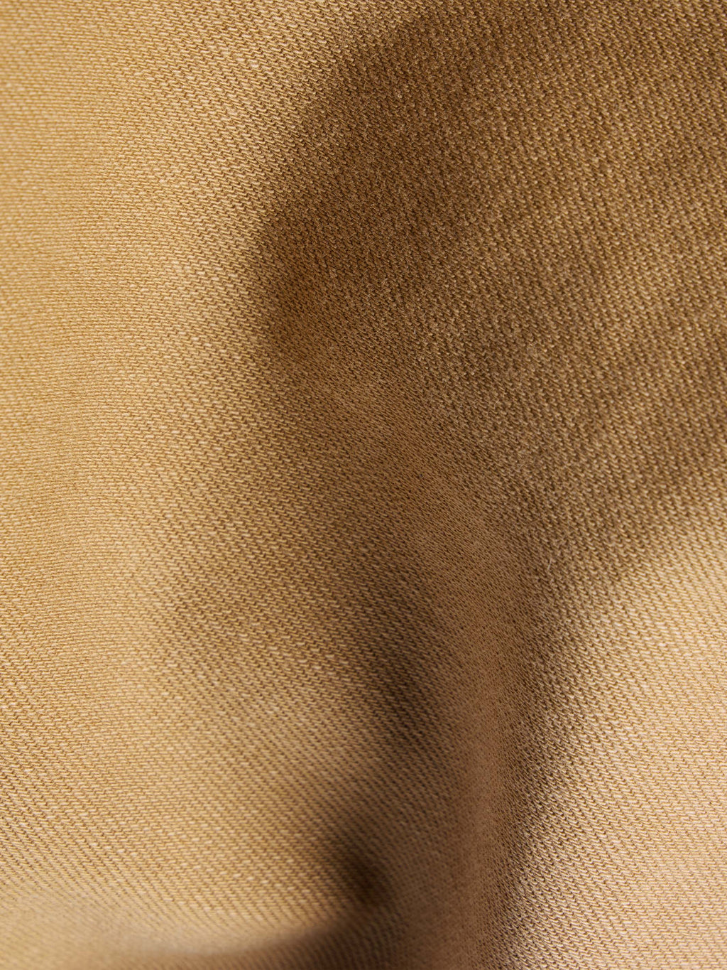 Faded chestnut denim shirt fabric texture close-up