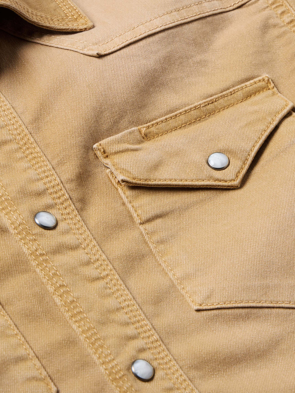 Faded chestnut western snap shirt detail with chest pocket and metal snap button