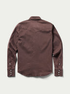 Women's faded maroon western denim snap shirt with long sleeves and snap front