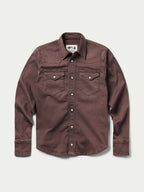 Women's faded maroon western denim snap shirt with two chest pockets and long sleeves