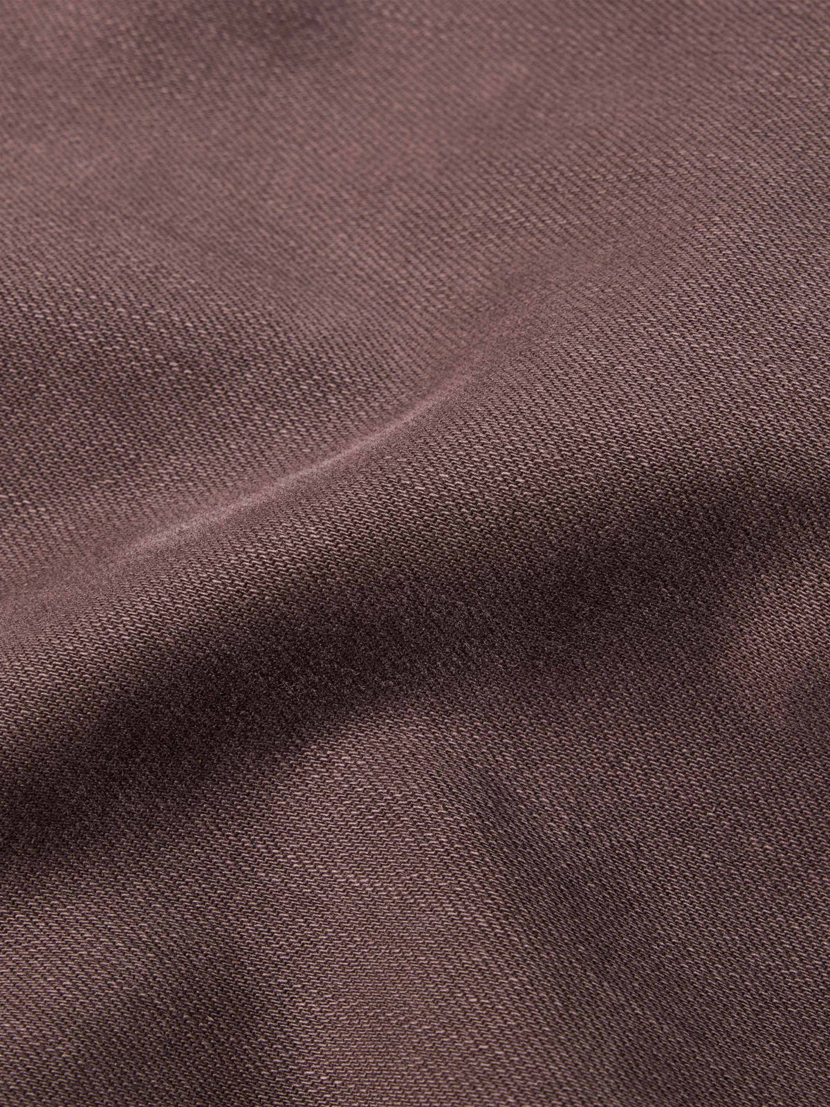Faded maroon denim fabric texture swatch