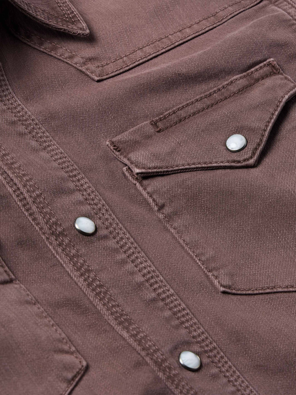 Faded maroon western shirt seam and chest pocket with snap buttons