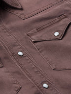 Faded maroon western shirt seam and chest pocket with snap buttons