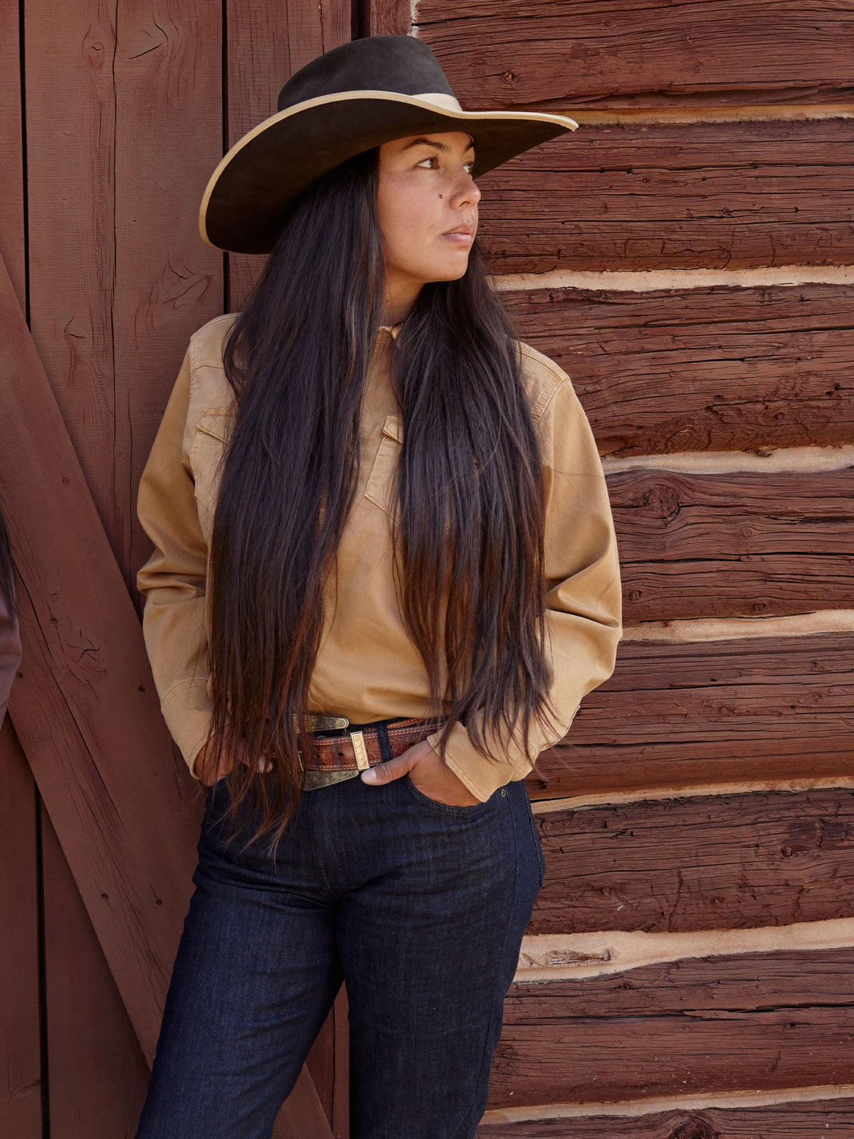 Women wearing faded chestnut denim snap shirt with chest pockets and snap placket