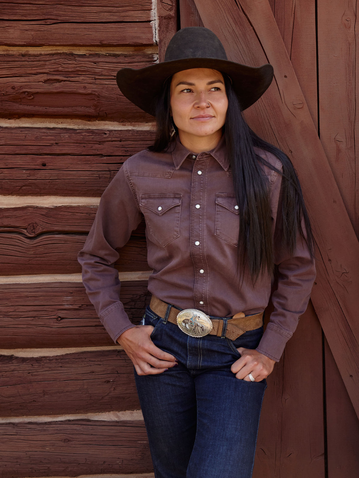 Faded maroon western denim snap shirt with chest pockets and long sleeves